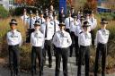 Cambridgeshire\'s 18 new police officers are pictured at their passing out ceremony.