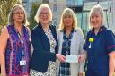 Left to right: Peterborough City Hospital charitable fund administrator Sue Jones, Fitzwilliam Quilters Group treasurer Jo Hemingray and committee member Lynne Hemsley present the cheque to Peterborough City Hospital dementia nurse specialist Alison