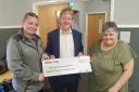 Sam Browning, community champion at Morrisons and Paul Bristow MP, presenting the donation of £10,500 to Evelyn Speechley of Chestnuts Community Centre