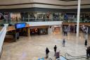 The robberies happened at the entrance to Queensgate shopping centre