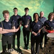 Students from the Peterborough Centre for Young Musicians (PCYM) with composer of Apkallu:Protector Martin Bright (L-R – Filip, Kacper, Benjamin, Lauren, Martin and Annabelle).