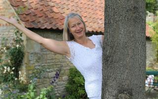 Oundle yoga teacher Nancy Taylor has raised more than £7,000 for Sue Ryder Thorpe Hall Hospice by hosting four years of free weekly online charity yoga sessions.